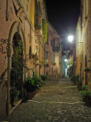 Obraz premium Pietravairano, Italy, 11/30/2019. A small road among the old houses of a medieval village in the province of Caserta, Italy.