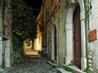 Fototapeta na wymiar Pietravairano, Italy, 11/30/2019. A small road among the old houses of a medieval village in the province of Caserta, Italy.
