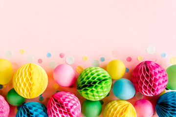 Balloons and confetti on pink background.  Birthday, holiday concept. Flat lay, top view. Birthday party background