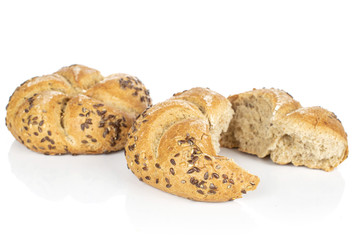 Group of one whole two halves of sesame kaiser roll isolated on white background