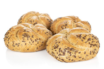 Group of four whole sesame kaiser roll isolated on white background