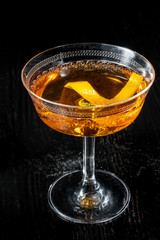 Classic Negroni cocktail isolated on black background.