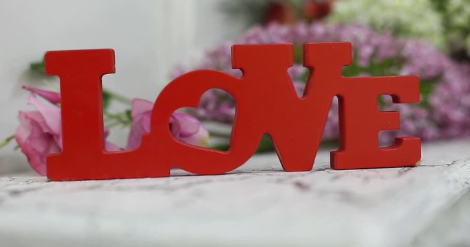 wedding table decoration with flowers, flower decoration wedding table, wedding florist, wedding at the table is Pano with letters and monograms, rose flowers and white orchid