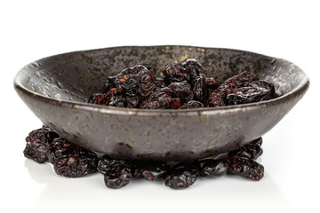 Lot of whole dried cowberry................ ring in glazed bowl isolated on white background