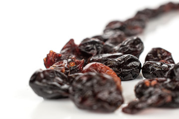 Lot of whole dried cowberry................ isolated on white background