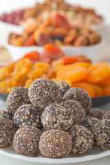 Healthy organic energy bites with nuts, cacao, and honey - sports food, vegetarian raw snack. Close-up