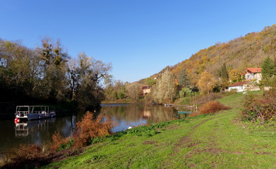 Fototapeta premium Seine river bank in the French Vexin regional nature park. Vetheuil village