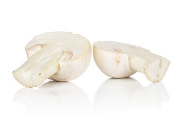Group of two halves of fresh white champignon isolated on white background