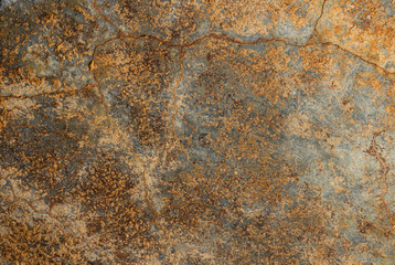 Wall of an old construction with a lot of texture and in warm color tones.