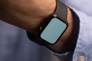 Close up of Businessman's hand looking at hand watch