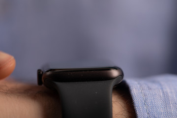 Close up of Businessman's hand looking at hand watch