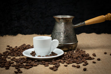 Coffee copper and white cup. Greek coffee with water and coffee pot. Turkish coffee and beans. White mug cafe.