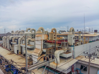 Industrial plant for filtering air polluted ponds with tanks, and water tanks,located on a rooftop building.