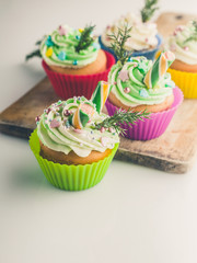 Vertical shot homemade delicious Christmas muffins on a white background. Traditional sweet dessert. Isolated composition. Close-up