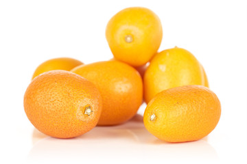 Group of six whole tasty orange kumquat heap isolated on white background