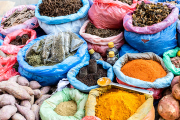 Saffron, turmeric, cinnamon, cloves, pepper and other spice in big bags at the street market in Kathmandu, Nepal.