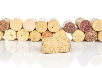 Lot of whole common wine cork wall isolated on white background