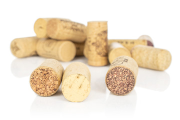 Lot of whole common wine cork isolated on white background