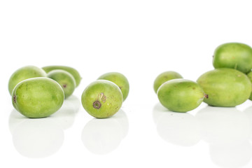 Lot of whole hardy green kiwi isolated on white background