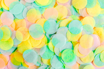 Colorful paper confetti on pink background. Celebration concept. Flat lay. Top view.