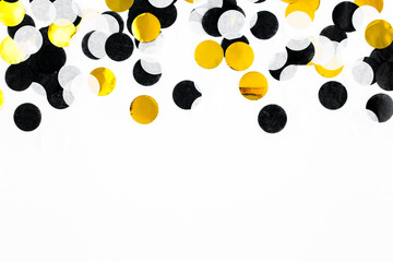 Colorful paper confetti on white background. Celebration concept. Flat lay. Top view.