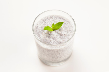 Chia pudding with mint on a white background. Space for text or design.