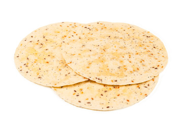 Pitta bread with seeds isolated on white