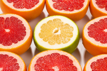 Pomelo and grapefruit slices background.