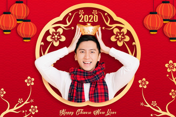 asian young  man celebrating for chinese new year. chinese text happy new year 2020