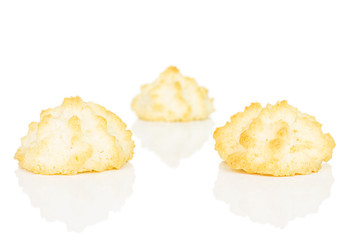 Group of three whole homemade golden coconut biscuit isolated on white background