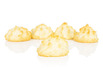 Group of five whole homemade golden coconut biscuit isolated on white background
