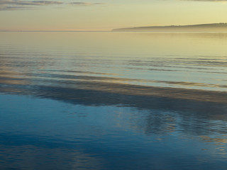 beautiful landscape with morning mist above sea, blurred sea background