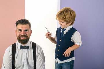 Happy son cuts fathers hair. Shaving man and razor man. Barber Shaves and Trims. Beard styling cut....