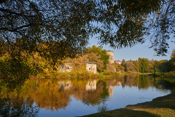 Old buildins in autumn park (Russia, Pskov)