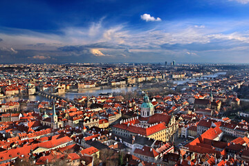 PRAGUE, CZECH REPUBLIC. Panoramic view of the city and Vltava river from the South Tower of St Vitus Cathedral. To the left of the picture you can see the famous Charles' bridge.