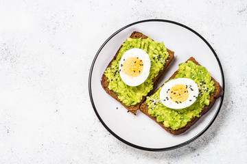 Avocado Sandwiches on white background.