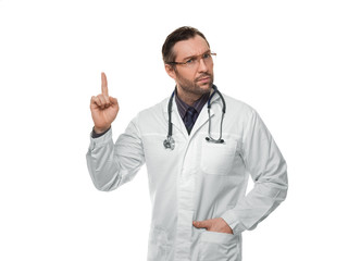 Photo of male doctor with stethoscope and keeps finger in attention sign. Isolated on white.