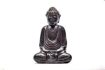 buddha statue meditating with a white background