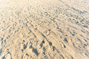 sandy beach with human footprints