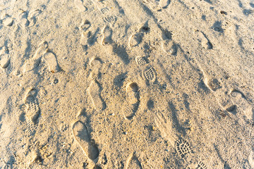 sandy beach with human footprints