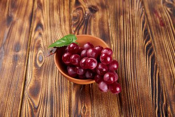 cherries in a bowl on wooden table