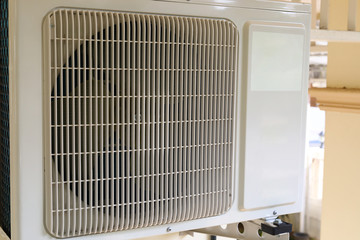 air compressor conditioner installing on wall of residential house