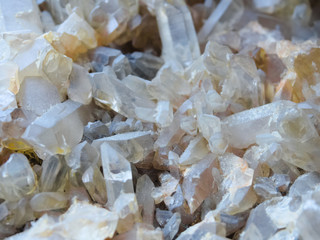 Background, smoky quartz crystals cluster close-up, in the rock. The most common mineral