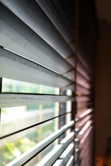 brown blind shade and mosquito wire screen on window, interior design decoration in home office