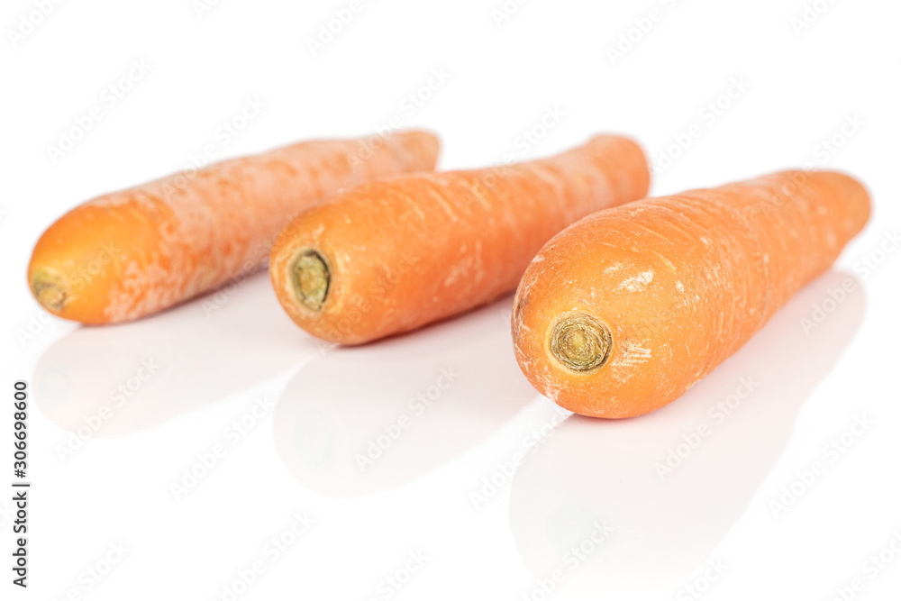 Poster Group of three whole bright fresh orange carrot isolated on white background