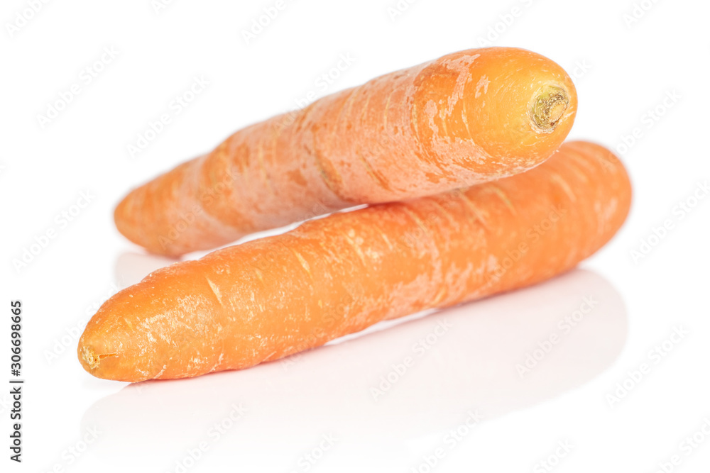 Wall mural Group of two whole fresh orange carrot isolated on white background