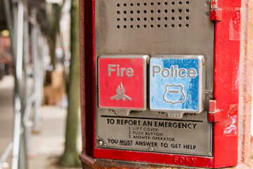 A public service totem to call the police and firefighters in Brooklyn, New York