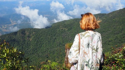 girl looking at the mountains, landscape sky