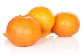 Group of three whole bright fresh orange mandarin isolated on white background