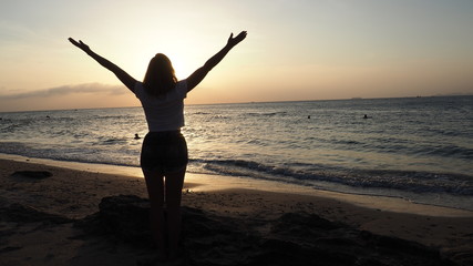 girl standing at the beach sunset thailand koh lanta